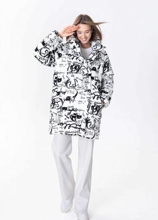 Black and white cropped jacket with an active print 500325 a LOT1 photo