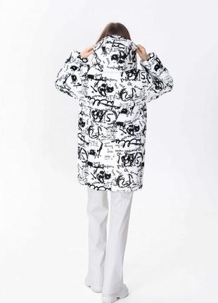 Black and white cropped jacket with an active print 500325 a LOT4 photo