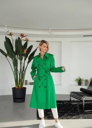 Woman bright green trench coat