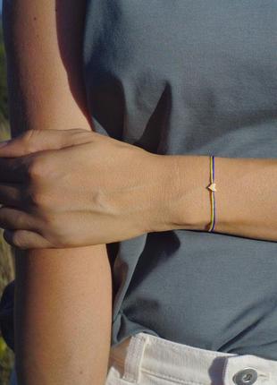 BRACELET WITH A BLUE-YELLOW THREAD AND A GOLD 14K HEART2 photo