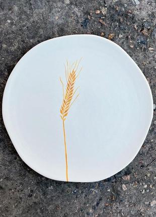 Handmade ceramic plate with ear of wheat