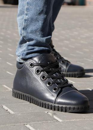 Winter men's boots of blue color, on an elastic sole