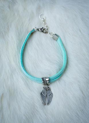 Suede bracelet - amulet with pendant "wings"2 photo