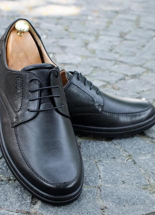 Stitched men's shoes made of genuine leather and elastic, stitched sole. IKOS 4093 photo