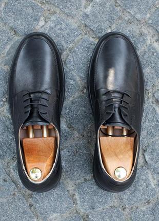 Stitched men's shoes made of genuine leather and elastic, stitched sole. IKOS 4091 photo