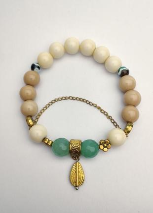 Bracelet with golden charms and natural stones