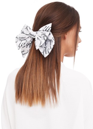 White bow with black letters. Collection "With Ukraine in the heart"1 photo