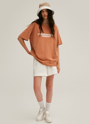 Caramel jersey unisex T-shirt "Unbreakable parent" by Must Have